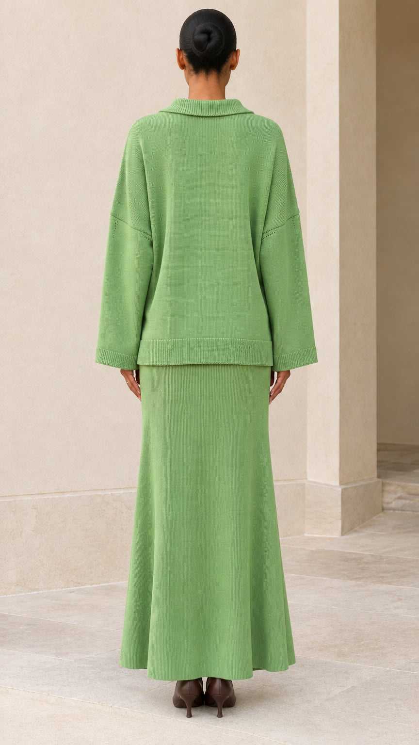 Back view of model wearing relaxed Sage Green knit pullover and maxi skirt