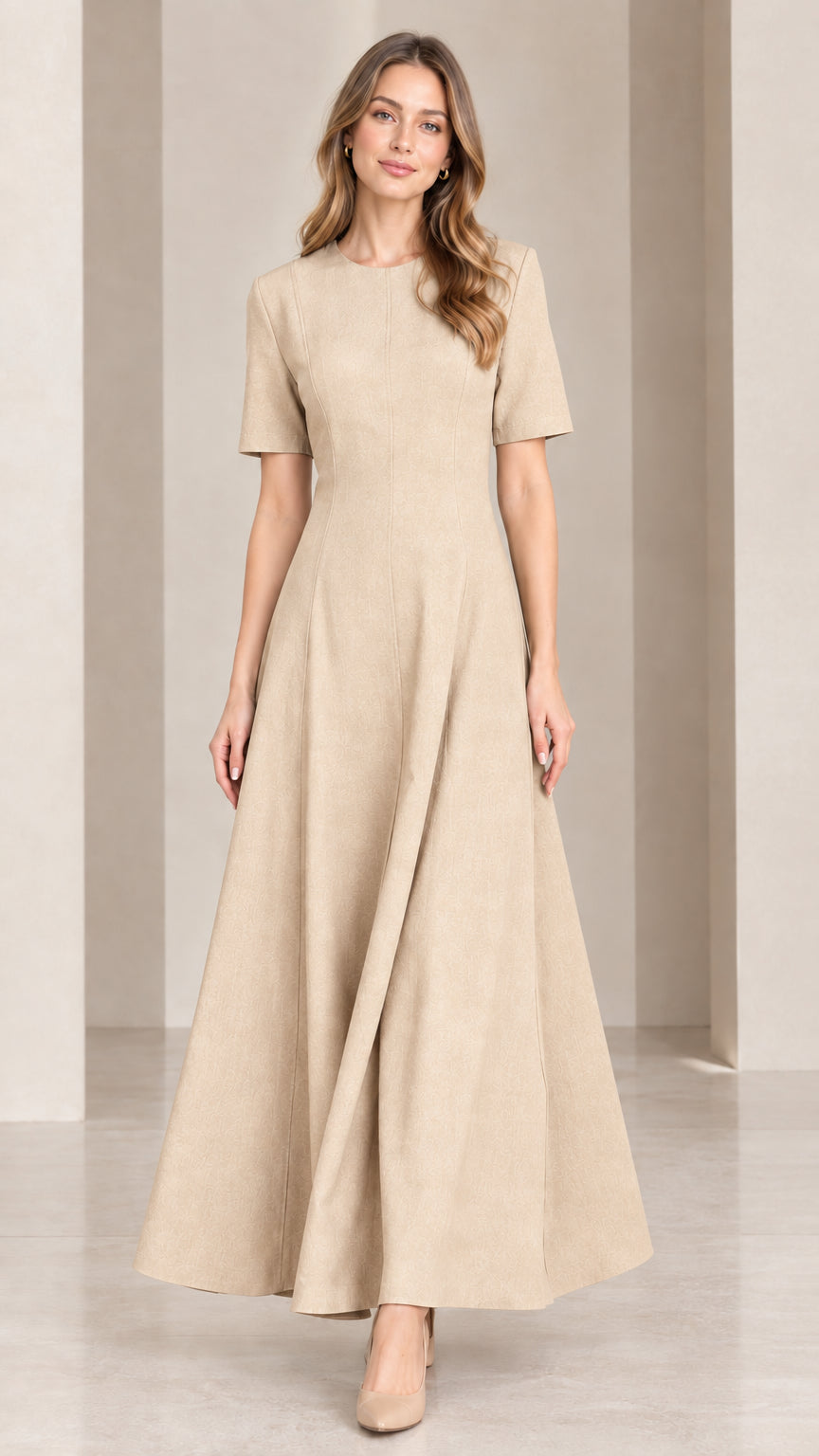 Front view of woman wearing neutral beige short sleeve A-line maxi dress