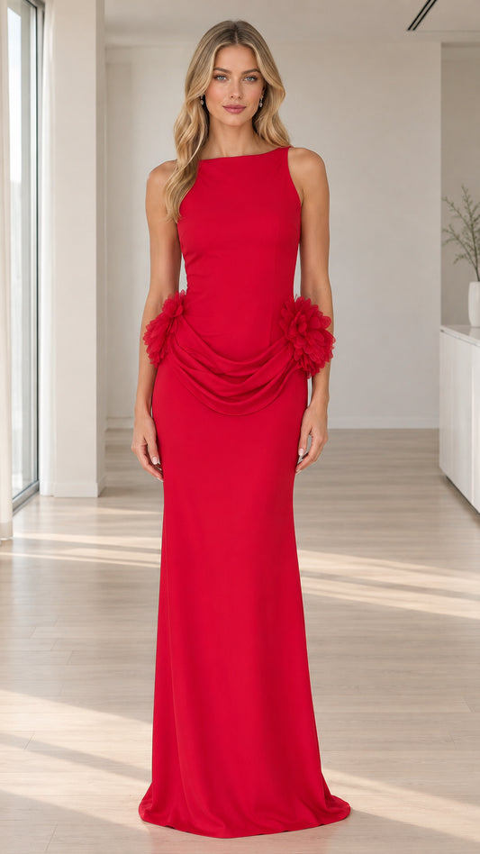 Front view of model wearing sleeveless red maxi gown with boat neck and draped floral hip details
