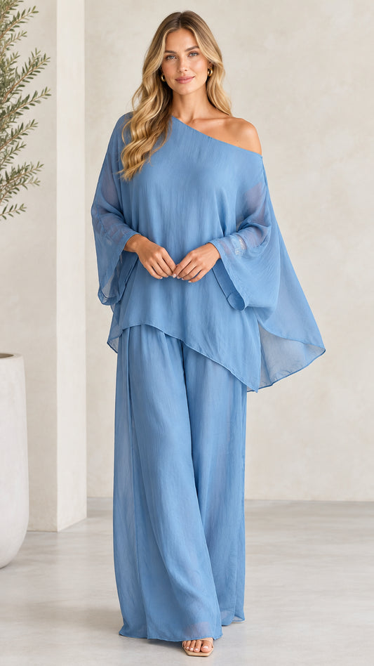 Front view of woman wearing Dusty Blue one-shoulder top and wide-leg pant set