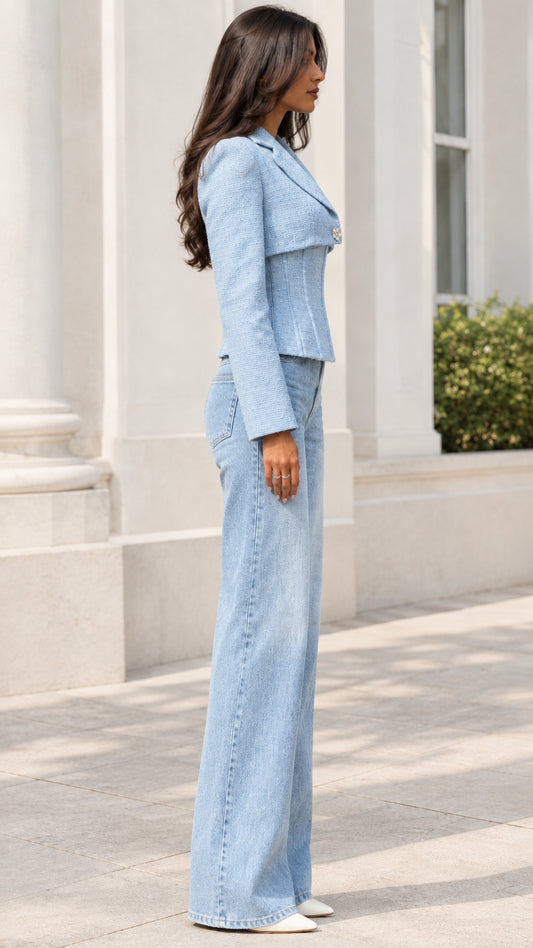 Side profile of model wearing Light Blue tailored corset tweed jacket