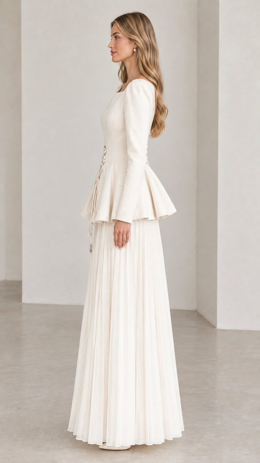 Off-white long sleeve peplum dress side view showing pleated maxi skirt