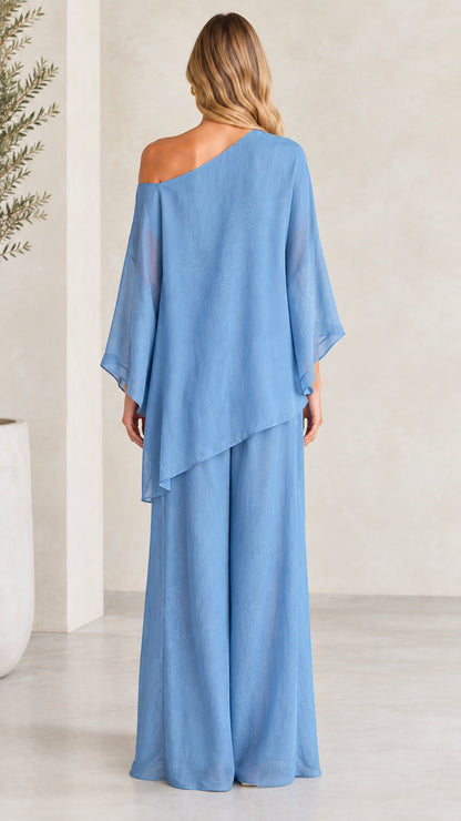 Back view of woman wearing Dusty Blue asymmetric one-shoulder two-piece outfit