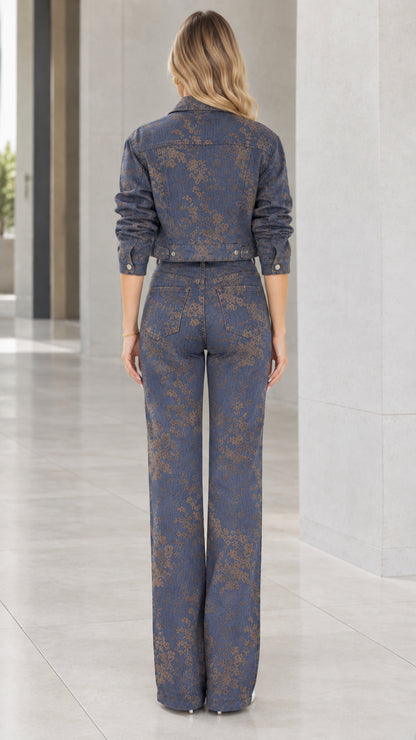 Back view of model wearing Denim Blue floral cropped jacket and high-waisted wide-leg trousers