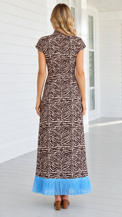 Back view of brown zebra print mock neck maxi dress showing back zipper and fit