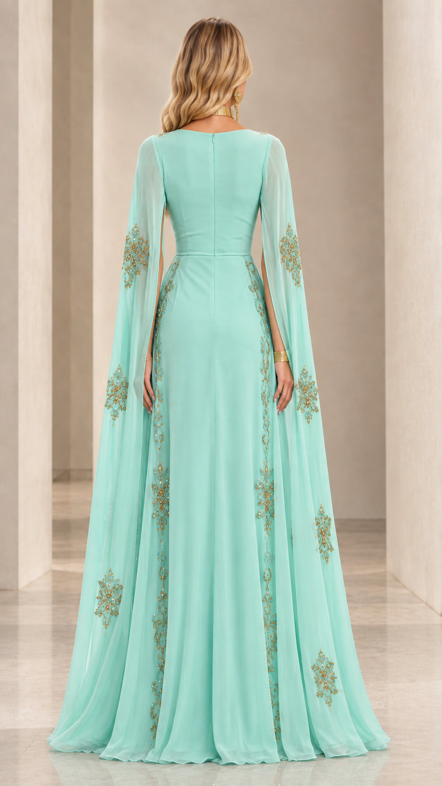 Back view of floor-length mint green cape sleeve evening dress with sequin detail
