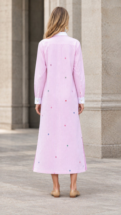Back view of woman wearing pink striped embroidered maxi shirt dress