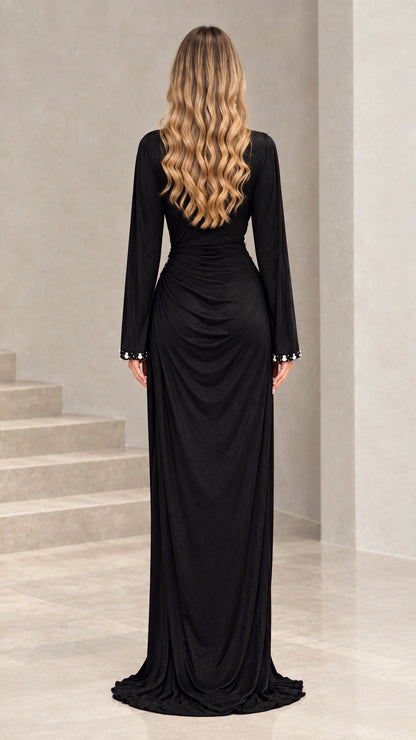 Back view of floor-length black evening gown with long sleeves