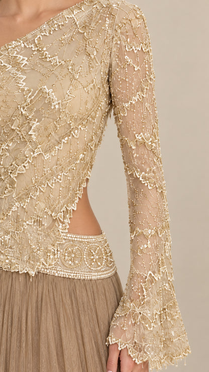 Close-up detail of beaded lace bodice, flared cuff, and side waist cutout