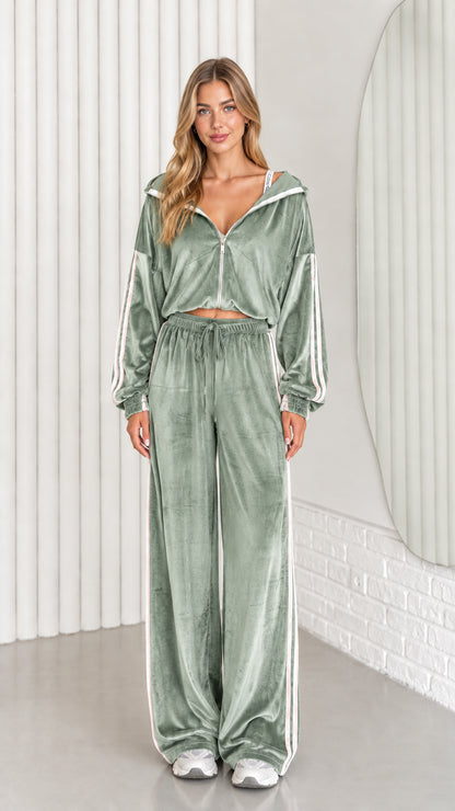 Front view of woman wearing sage green velour cropped zip-up hoodie and wide leg pant set